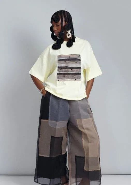 Fashbe Image of a woman in woven braids and patterned pants